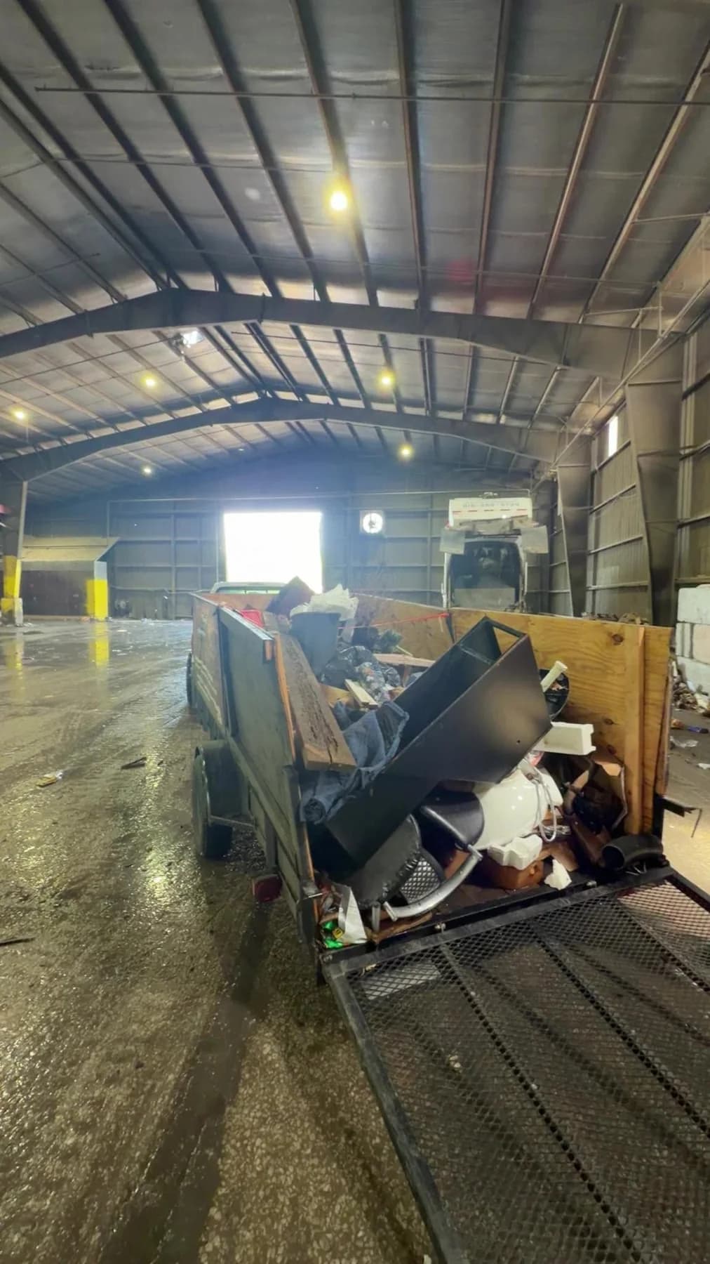 Loaded trailer inside a commercial cleanout space